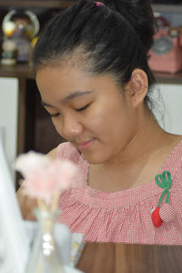 Portrait of a smiling young woman holding ice cream