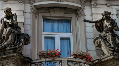 Low angle view of statue against building