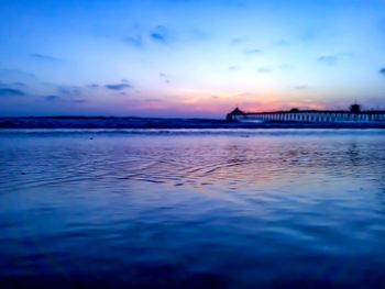 Scenic view of sea against sky at sunset