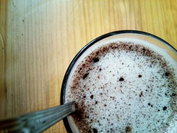 Close-up of cappuccino on table