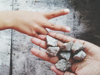 Close-up of hand holding stones