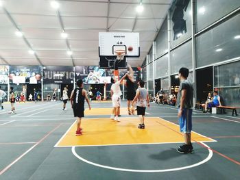 People playing basketball court