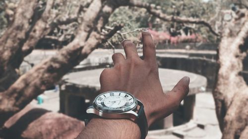 Close-up of human hand against blurred background