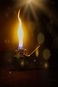 Close-up of cigarette lighter in darkroom
