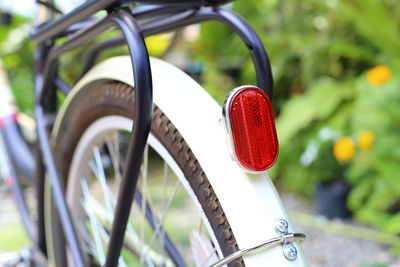 Close-up of red bicycle wheel