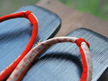 Close-up of geta sandal on hardwood floor at home