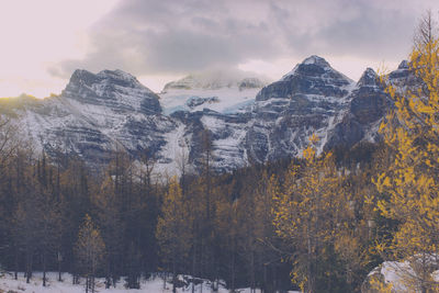 Scenic view of snow covered mountains against sky