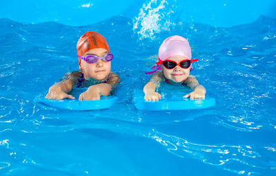 Portrait of woman swimming in pool