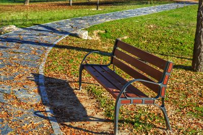 High angle view of empty bench in park