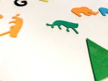 Close-up of paper toy against white background