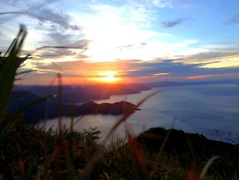 Scenic view of landscape against sky during sunset