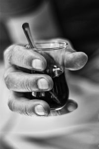 Close-up of hand holding tea cup