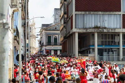 Crowd of devout catholics of santa barbara participate in the procession 