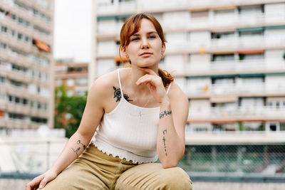 Urban portrait of a young woman in the middle of the city