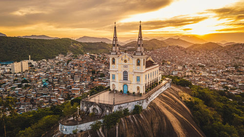 Aerial view of church on hill amidst town