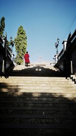 Low angle view of people walking on steps