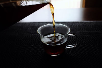 Close-up of tea in glass on table