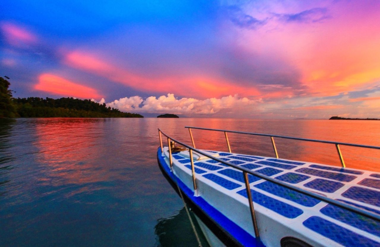 transportation, nautical vessel, sunset, water, mode of transport, sky, boat, cloud - sky, moored, beauty in nature, scenics, sea, cloudy, orange color, tranquility, nature, tranquil scene, cloud, reflection, dramatic sky