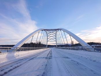 View of bridge against cloudy sky