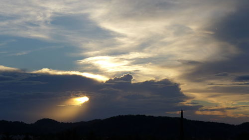 Low angle view of silhouette trees against sky during sunset