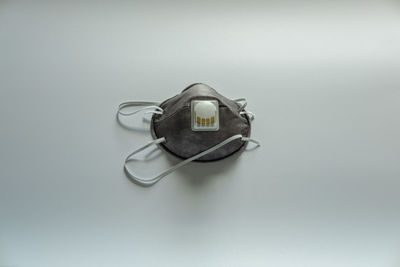 Close-up of coin-operated binoculars against white background
