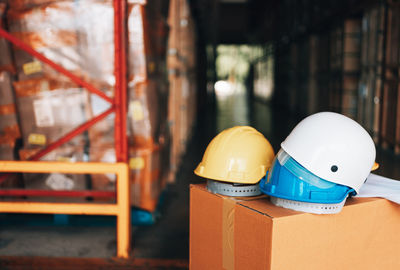 Close-up of toys on table against building