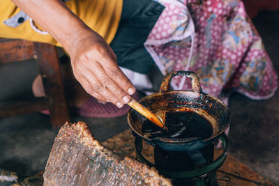 Midsection of person preparing food