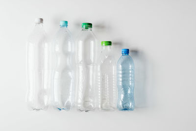 Close-up of bottles against white background