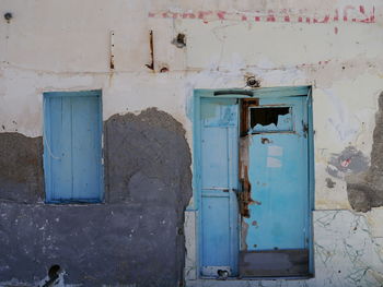 Closed door of old abandoned building