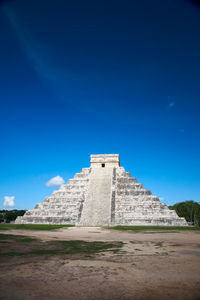 Low angle view of historical building against blue sky