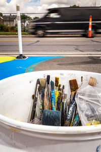 High angle view of paintbrushes on road