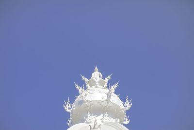 Low angle view of statue against clear blue sky