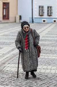 Portrait of man standing on street