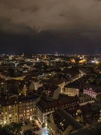 High angle shot of illuminated cityscape against sky at night