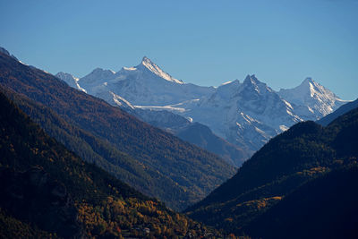 Scenic view of mountains against sky at night