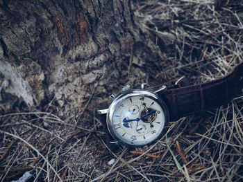 High angle view of clock on field