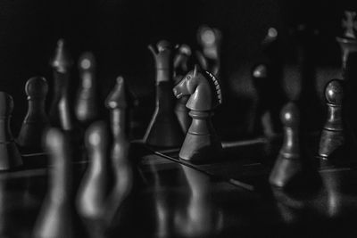 Close-up of chess pieces on table