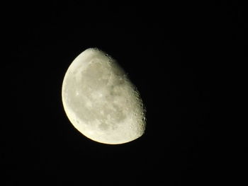 Low angle view of moon against sky at night