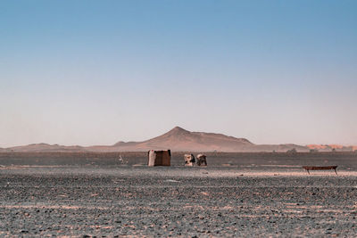 Scenic view of desert against clear sky. symmetric view.