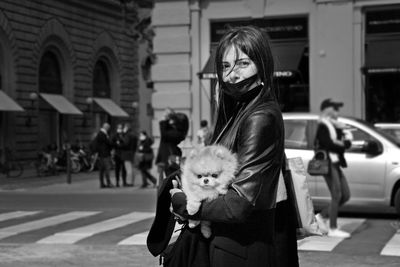 Portrait of woman standing on city street