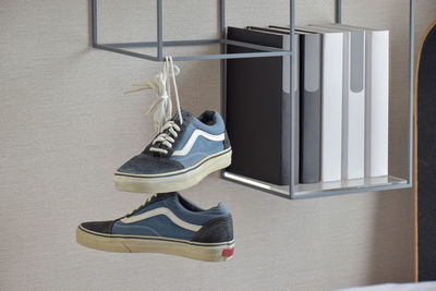 High angle view of shoes hanging on floor against wall