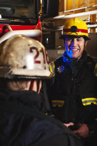 Two firefighters talking