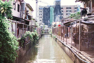 Panoramic view of canal amidst buildings in city