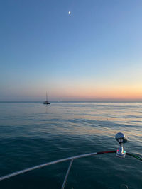 Scenic view of sea against clear sky during sunset