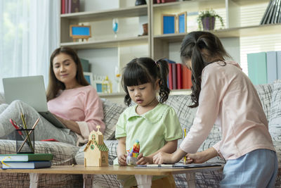 Female friends working at home