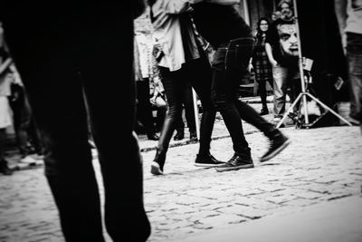 Low section of people standing in city