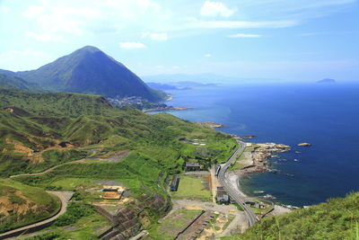 High angle view of road by sea against sky