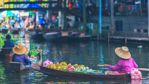 People in boat at lake