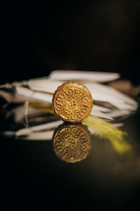 Close-up of art on table against black background