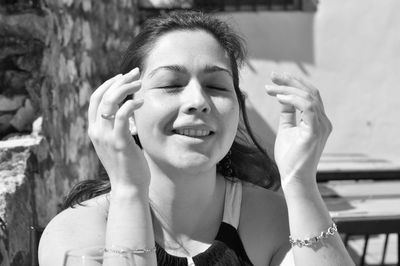 Close-up of young woman with eyes closed